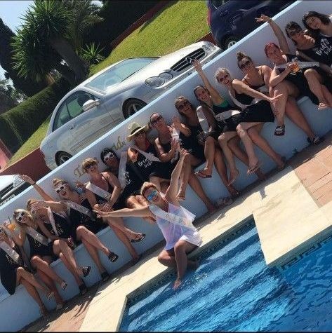 Hen party guests enjoying cocktails by the pool